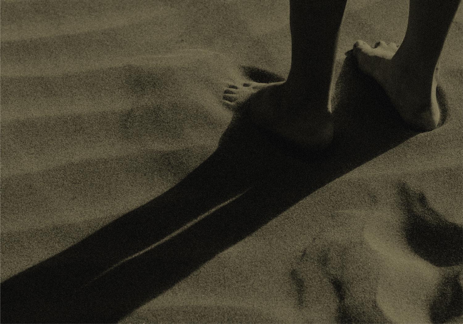 Footprints in the sand capturing quiet moments by the shore